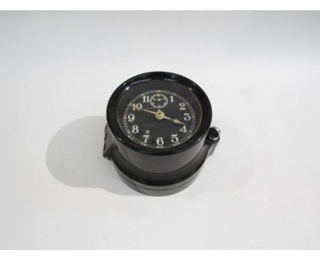 A WWII US navy mark I-boat clock, 1941, housed in bakelite case, No. 10668. No key. 9cm diameter dial 