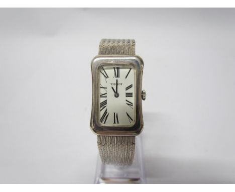 A Tissot silver wristwatch of cushion style, Deco form face, snake link strap, cased 