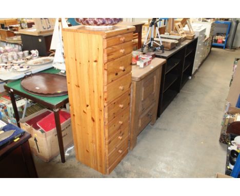 A narrow pine chest fitted eight drawers