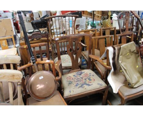 A stick back elbow chair with tapestry seat and a Chippendale style elbow chair with tapestry drop in seat