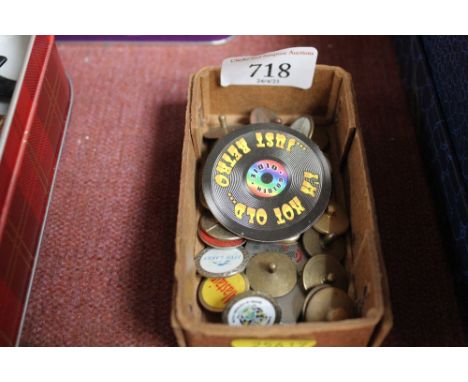 A small box of vintage golf markers