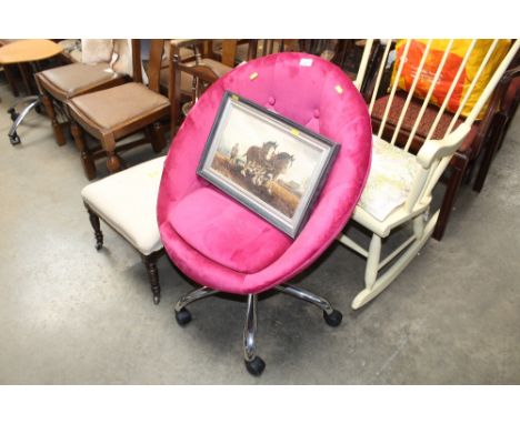 A button back upholstered swivel tub chair