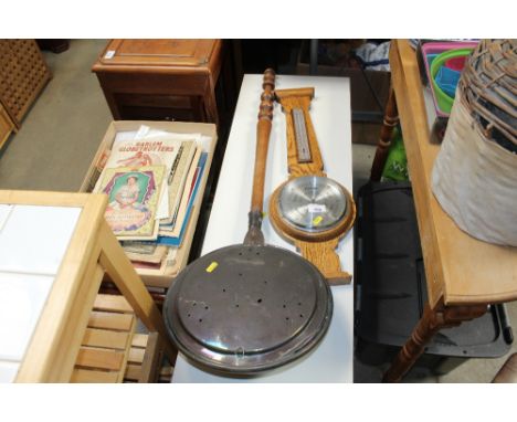 An oak cased barometer and copper warming pan