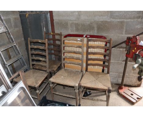 A set of four ladder back dining chairs