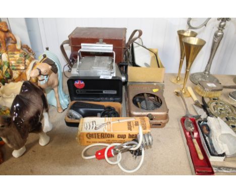 A Meg insulation tester; a cup heater sold as collectors item; Deluxe Philips shaver etc