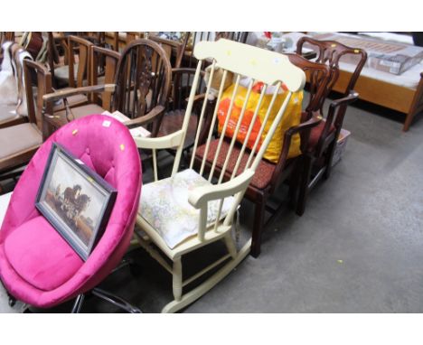 A painted stick back rocking chair