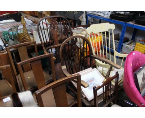 An antique oak and elm stick and wheel back elbow chair and an oak stick and wheel back elbow chair