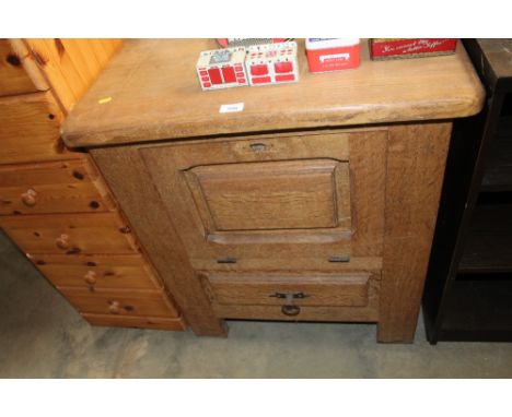 A light oak side cupboard fitted single drawer below