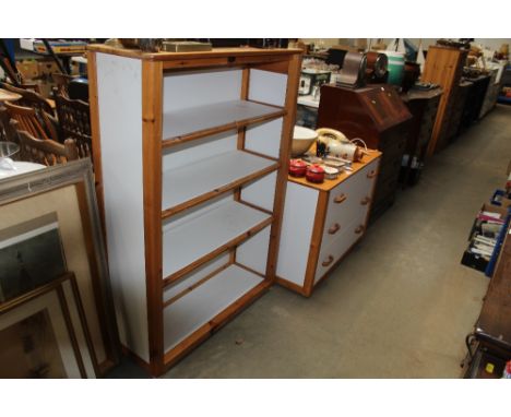 A modern pine and laminate chest fitted three drawers and matching book case