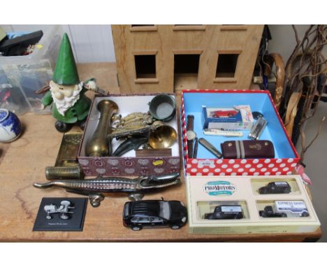 A quantity of diecast vehicles; a Casablanca wrist watch; penknives; nut cracker in the form of a crocodile; brass plaques et