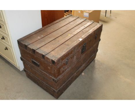 A vintage travelling trunk; a wooden storage crate and a collection of shoe trees