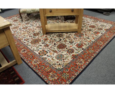 An Indian carpet, with an allover design of vines on a cream central field, 302cm by 391cm CONDITION REPORT: Pile in good/fai