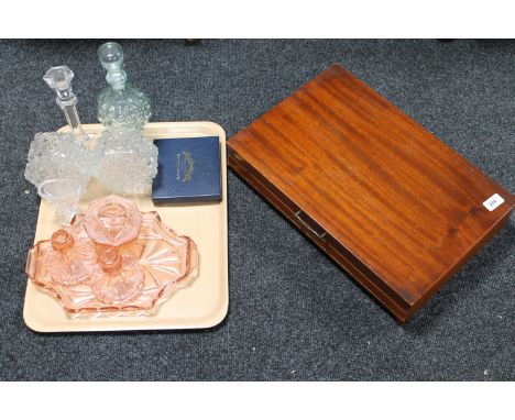 A tray of glass ware - candlestick, coloured glass dressing table set etc and a canteen of Ashbury plated cutlery 