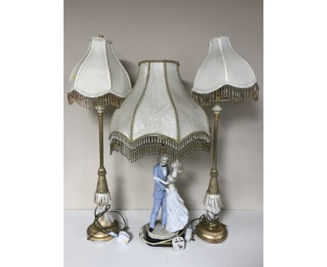 A china figure table lamp from the Elegant Collection and a pair of contemporary gilt table lamps 