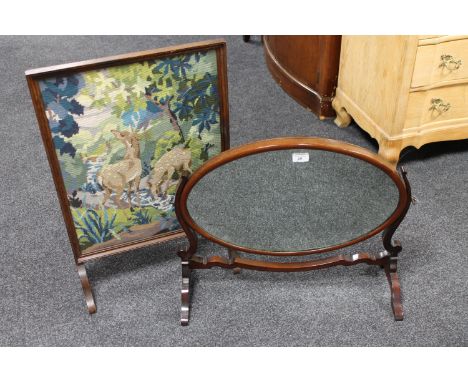 An antique mahogany dressing table mirror together with an oak framed tapestry fire screen