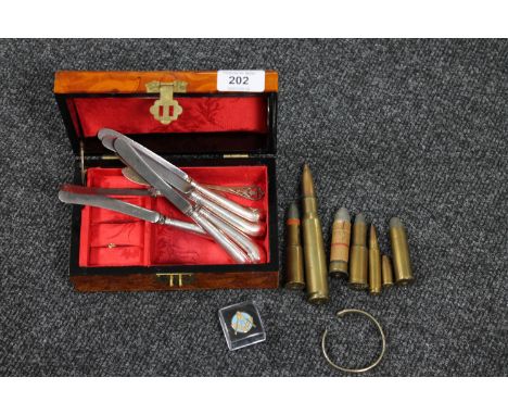 A trinket box containing a quantity of defunct ammunition, set of six silver handled knives, bangle, Masonic badge etc (Q)