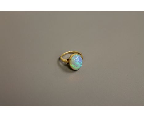 A fine quality opal ring set in 18ct gold, size K. CONDITION REPORT: The ring is in good condition. It is stamped '750' for 1