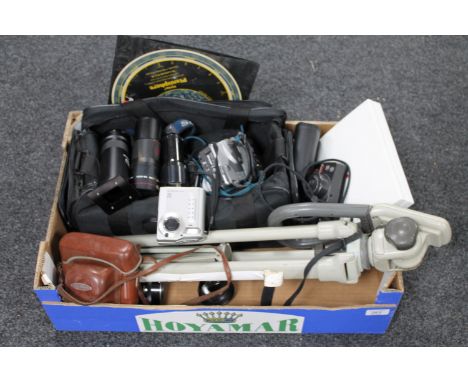 A box of camera bag and tripod, assorted digital cameras, telephoto lens, Philips Planisphere 