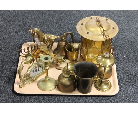 A tray of brass ware - bell, oil lamp, pestle and mortar, lantern shade etc 