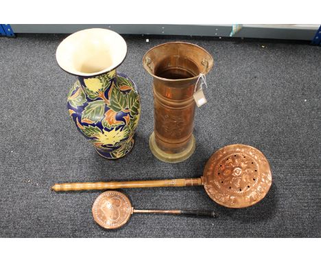 An embossed copper stick pot with two copper bed warming pans and large pottery jug 