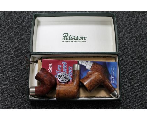 A Peterson's of Dublin boxed three pipe bowls