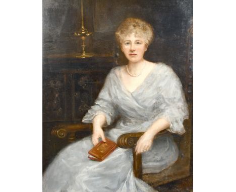 19th century school, A portrait of a seated lady wearing a pearl necklace and holding a book, oil on canvas, indistinctly sig