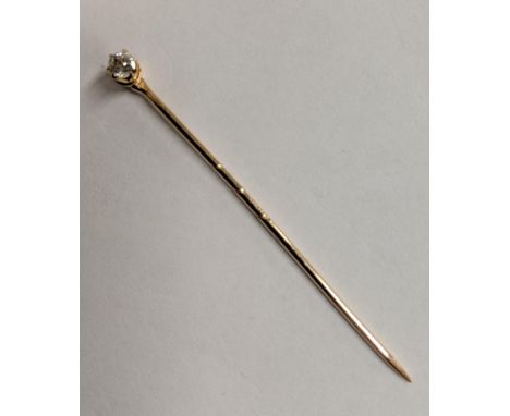 A gold stick pin, set with a diamond 0.2ct, 1.3gLocation: 