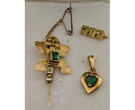 Gold to include a Mexican stick pin stamped 18k and a pendant 4g totalLocation: 