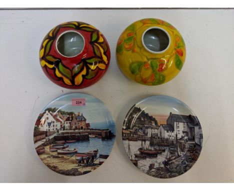 Two Poole pottery vases, Delphis pattern of bulbous form and two Poole pottery plates, one depicting a harbour scene in Polpe