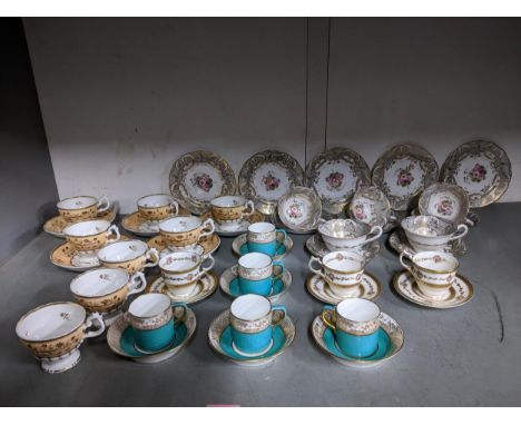 A selection of late 19th and early 20th century teacups and saucers and coffee cans, some retailed by Thomas Goode &amp; Sons