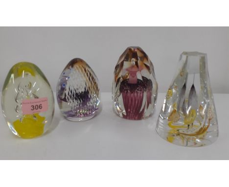 A group of four glass paperweights to include Caithness 'Lucy in the Sky' and 'Blast Off'Location: 6:2 