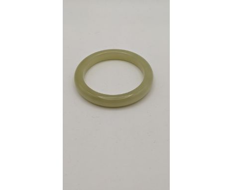 A pale green jade bangleLocation: 