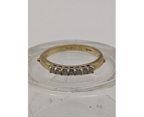 A 9ct gold ring set with seven diamonds 3.1gLocation: 