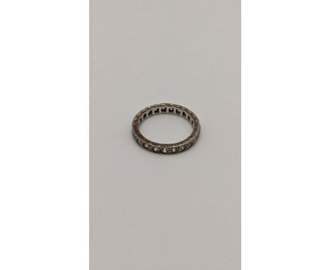 A white metal eternity ring set with sapphires, tested as 9ct gold, 2.7gLocation: 