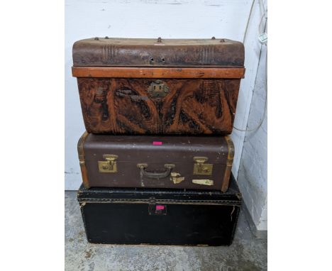 Vintage trunks to include a tin trunk, a wooden framed brown leather trunk and a black coloured travelling trunkLocation: 