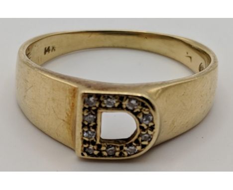 A gold ring set with diamonds in the shape of a D stamped 14k 5gLocation: 