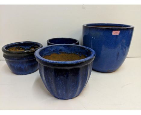 Four ceramic glazed blue garden pots, largest 31cm highLocation: 