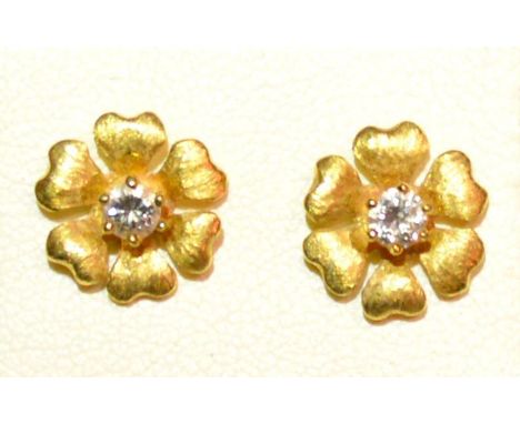 A Pair Of 18ct. Gold Solitaire Diamond Set Ear Studs Of Flower Head Form 