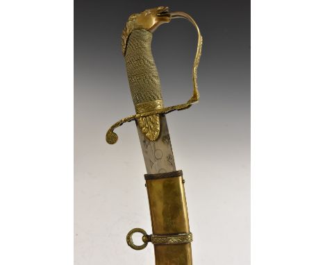 A cavalry officer's sword, 71cm curved blade etched with concentric circles, brass horse head pommel and D-shaped guard, wire