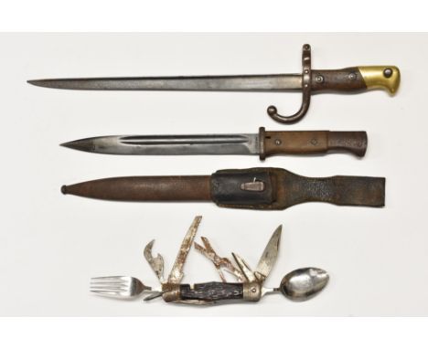 A German Wehrmacht K98 bayonet, leather frog, scabbard, dated 1942; a French Gras bayonet, dated 1876; a multi-blade knife, (