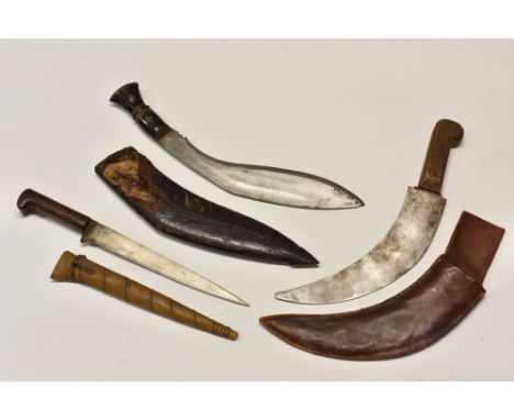 A curved fighting knife, stamped WCC, brown leather military type scabbard; a Nepalese kukri; a Burmese hunting knife (3) 