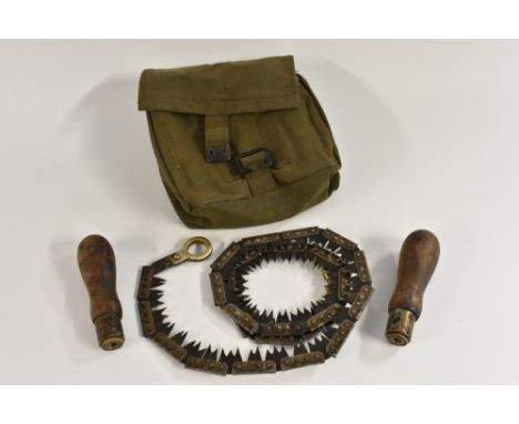 A military field tool kit, comprising a rolled-chain saw and an arrangement of fittings, canvas bag with broad arrow mark, 18