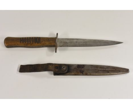 A World War I German kampfmesser trench fighting knife, 15cm pointed double-edged blade marked Solingen, two-piece wooden gri