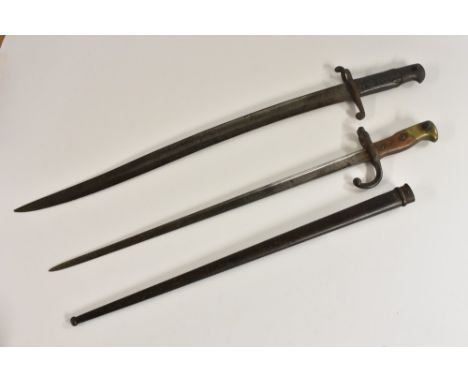 An 1856 pattern sword bayonet, 57cm curved fullered blade, two-piece chequered grip, 70.5cm long overall; a French Gras bayon