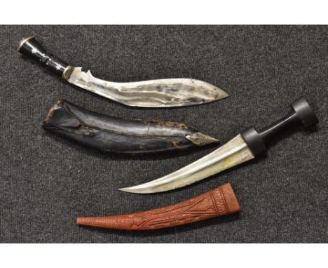 An Iraqi jambaya dagger, tooled leather scabbard inscribed in ink manuscript: Iraq 1942; a Kukri, (2)  