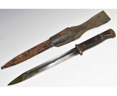 A German Wehrmacht K/98 mauser bayonet, 25cm straight fullered blade, stamped 41 cof, 5530, two-piece grip, steel scabbard, l