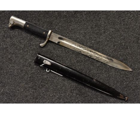 A German Wehrmacht dress bayonet, 25cm fullered blade brightly etched and engraved with motto Bur Erinnerung au meine Dienstz