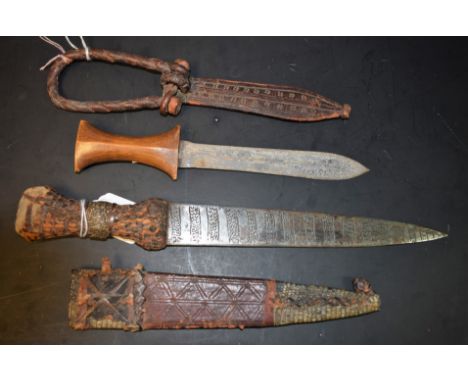 Sudanese Arm Dagger, late 19thC, with decorated leather and snakeskin scabbard, and another similar example (2)