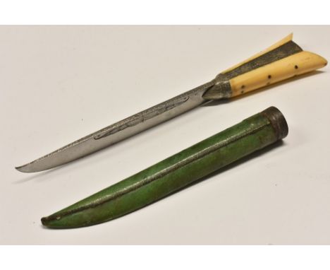 A North Indian karud dagger, 16cm blade engraved with scrolling leaves, two-piece grip, green leather scabbard, 28cm long ove