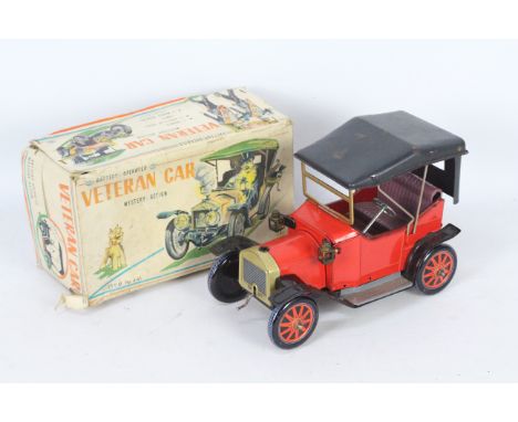 Yonezawa - A boxed battery operated Veteran Car witch has operating front lights, makes smoke and makes engine noises. The ca